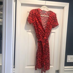 Coral and navy geometric wrap dress